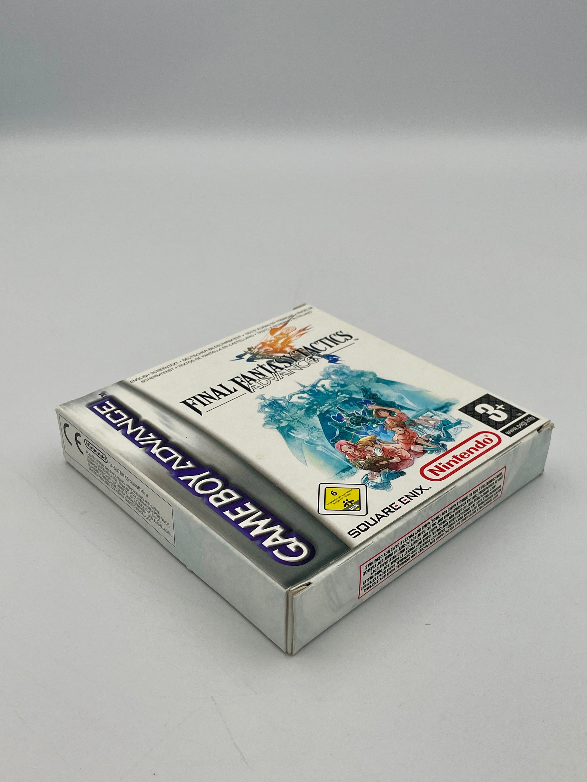 Game Boy Advance cartridge packaging for 'Final Fantasy Tactics' on a gray background