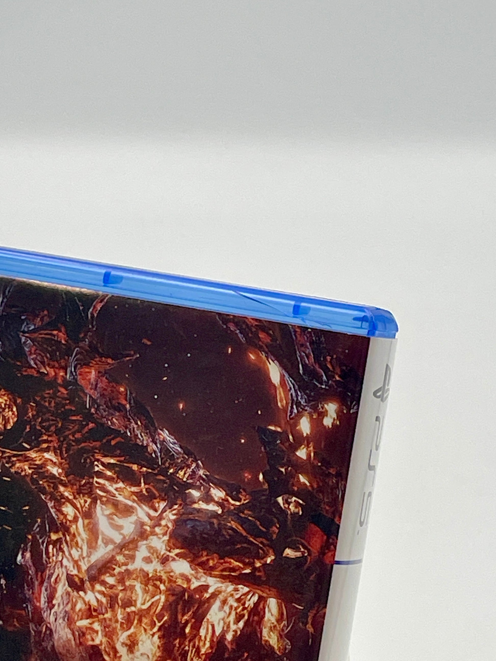 Close-up of a game case with a nature-themed design on a white background