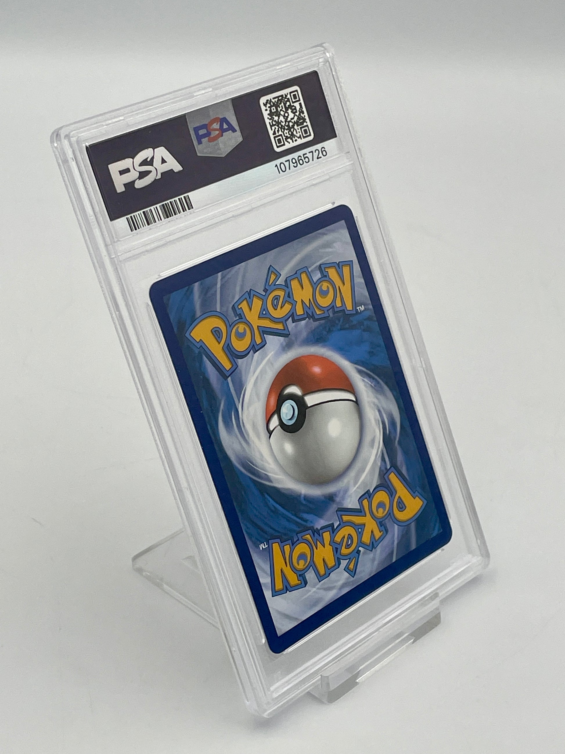 Pokémon trading card in a PSA protective case on a white background