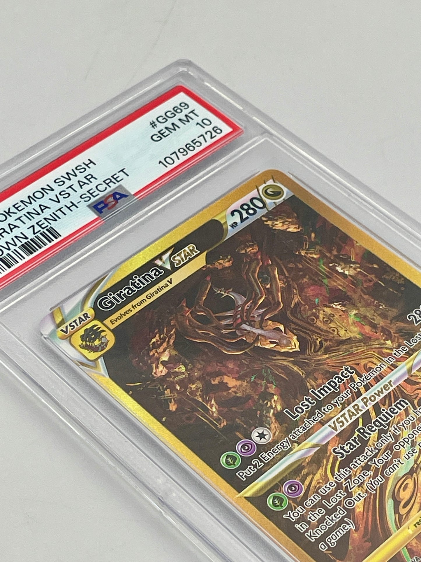 Pokémon trading card in a protective case with a visible PSA grading label.