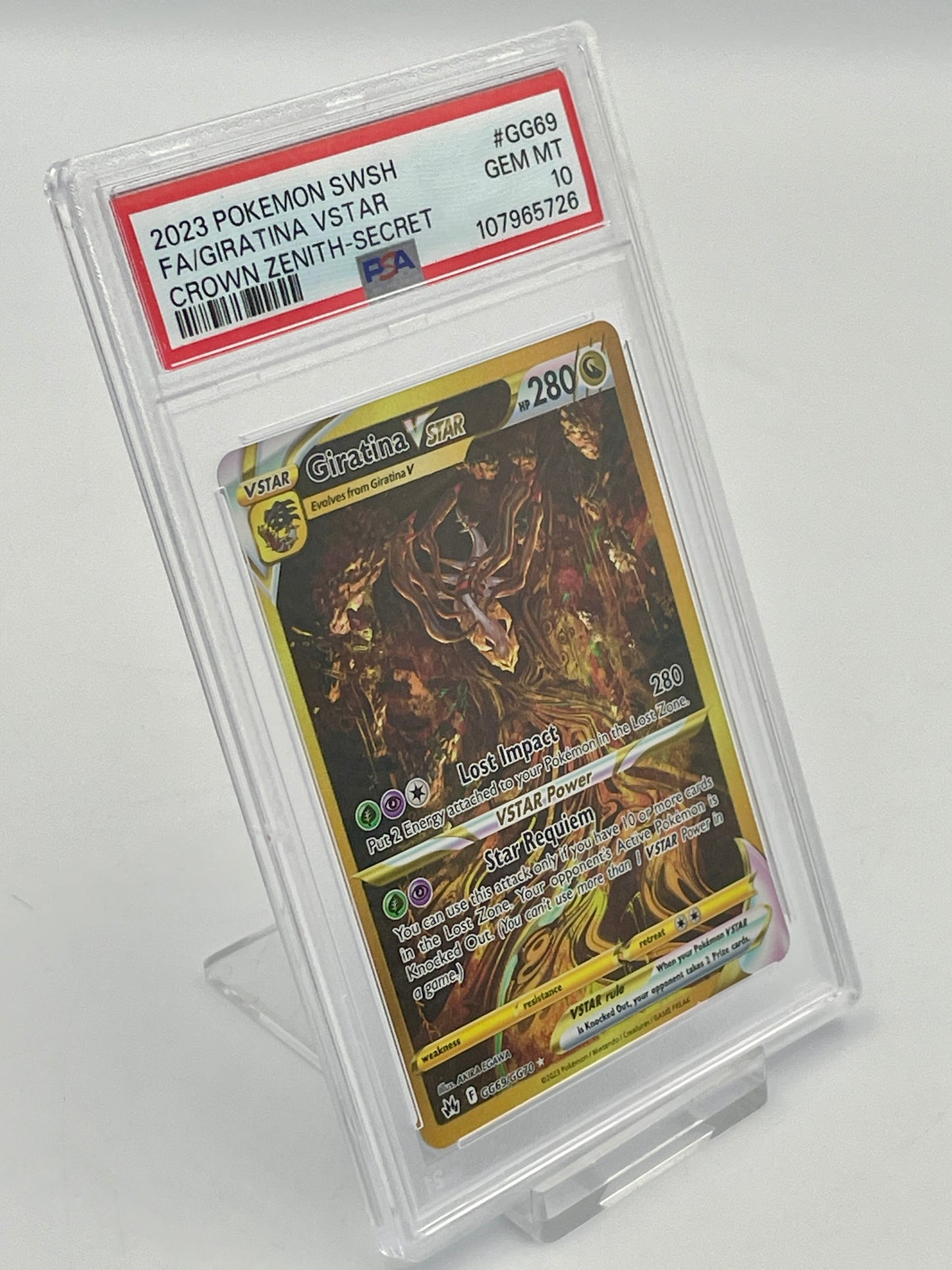 Pokémon trading card in a protective case on a white background