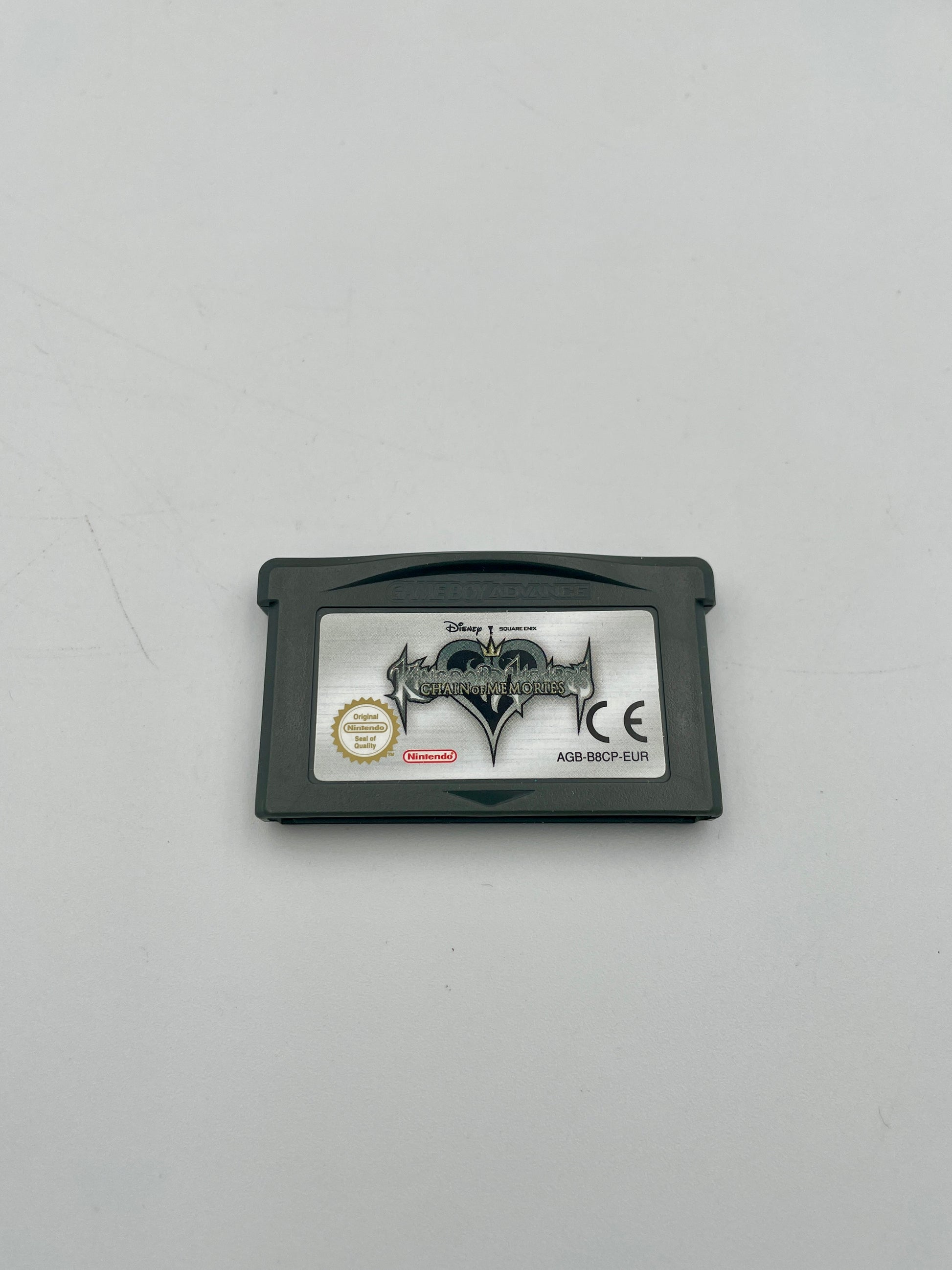 Game cartridge with branding on a gray background