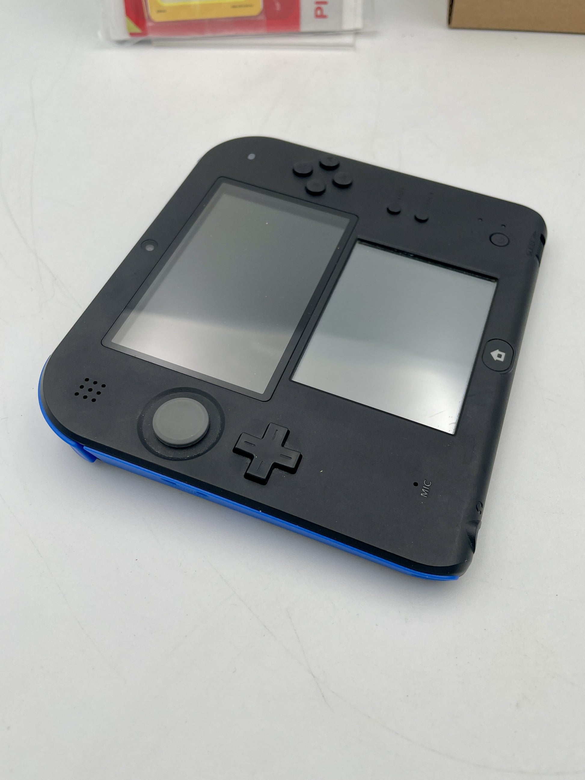 Nintendo 2DS Console Mario Kart 7 Edition Complete in Box – boxed Nintendo 2DS handheld bundle (stylus missing; game may not be pre-installed).