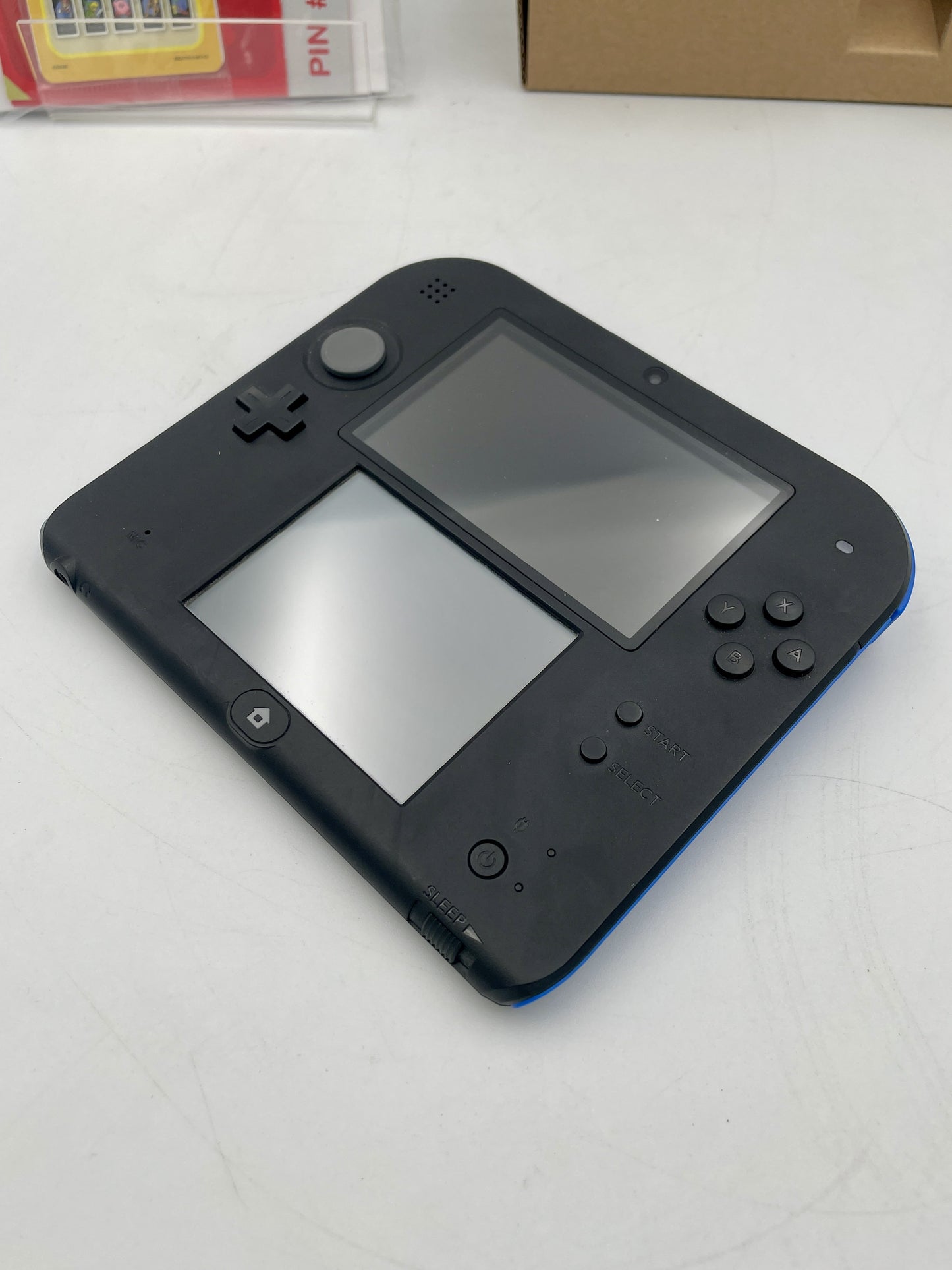 Nintendo 2DS Console Mario Kart 7 Edition Complete in Box – boxed Nintendo 2DS handheld bundle (stylus missing; game may not be pre-installed).