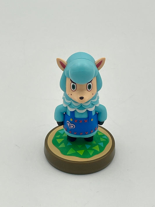 Toy figure with blue hair and a blue outfit on a white background