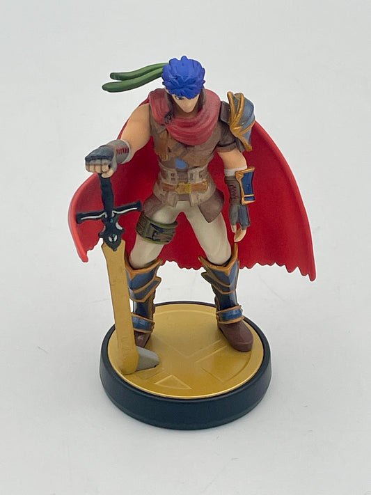 Figurine of a warrior with a red cape and blue hair on a white background