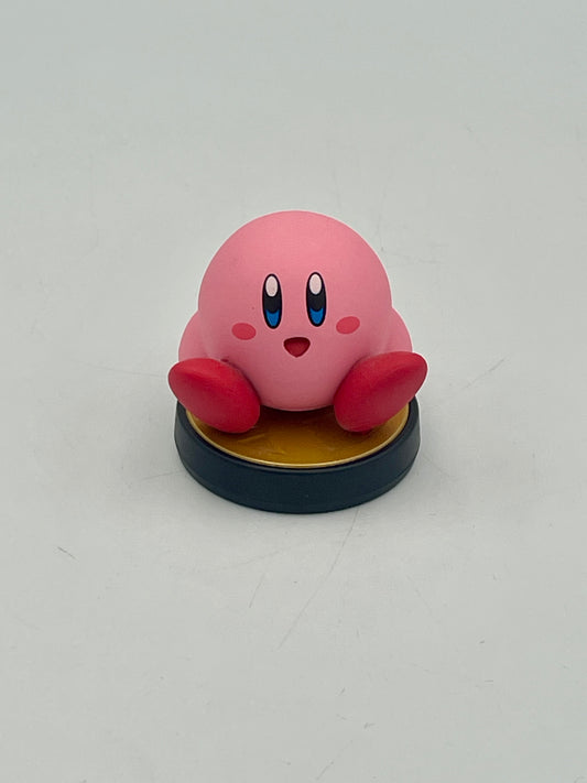 Pink cartoon character figurine on a gray background