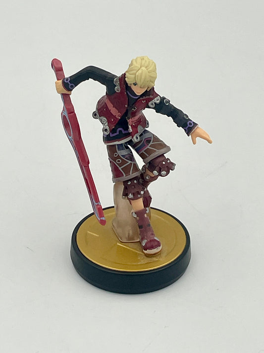Figurine of a character with a red weapon on a white background