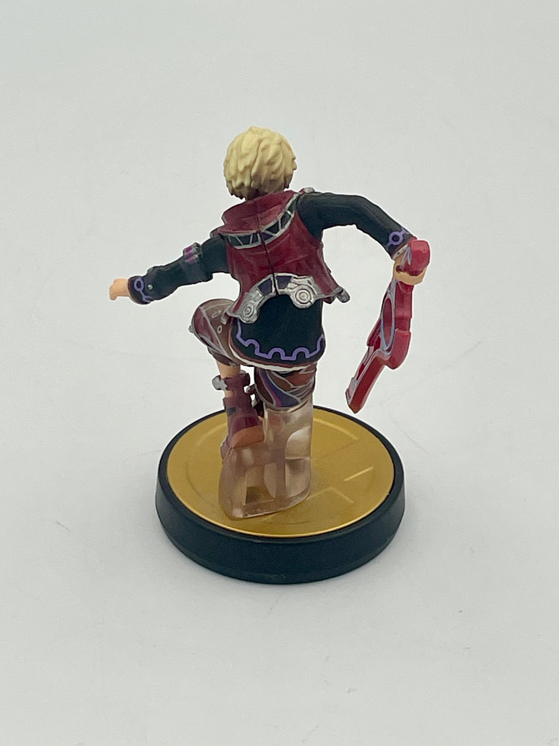 Figurine on a round base with a white background
