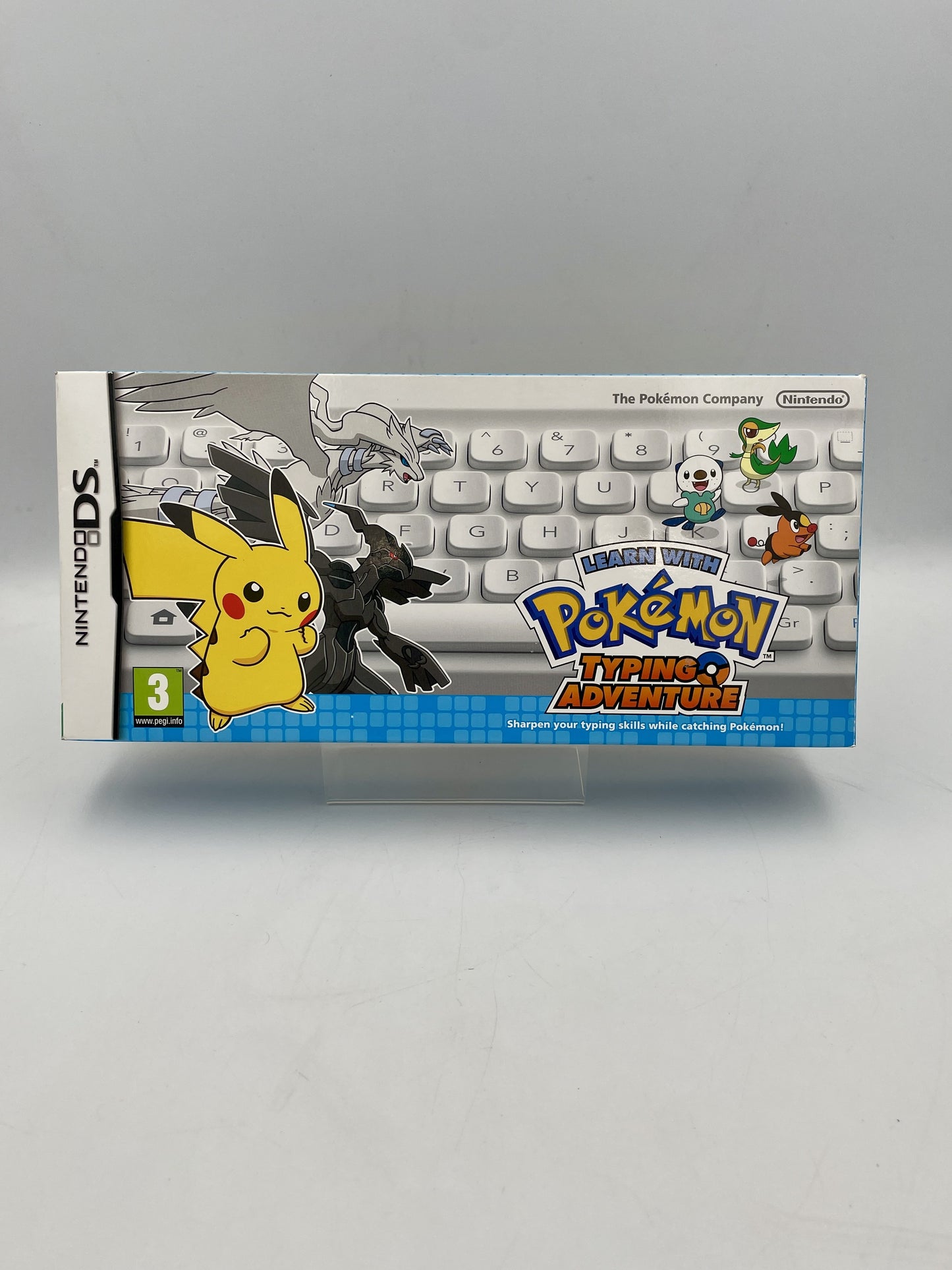 Pokémon Typing Adventure game box for Nintendo DS on a gray background