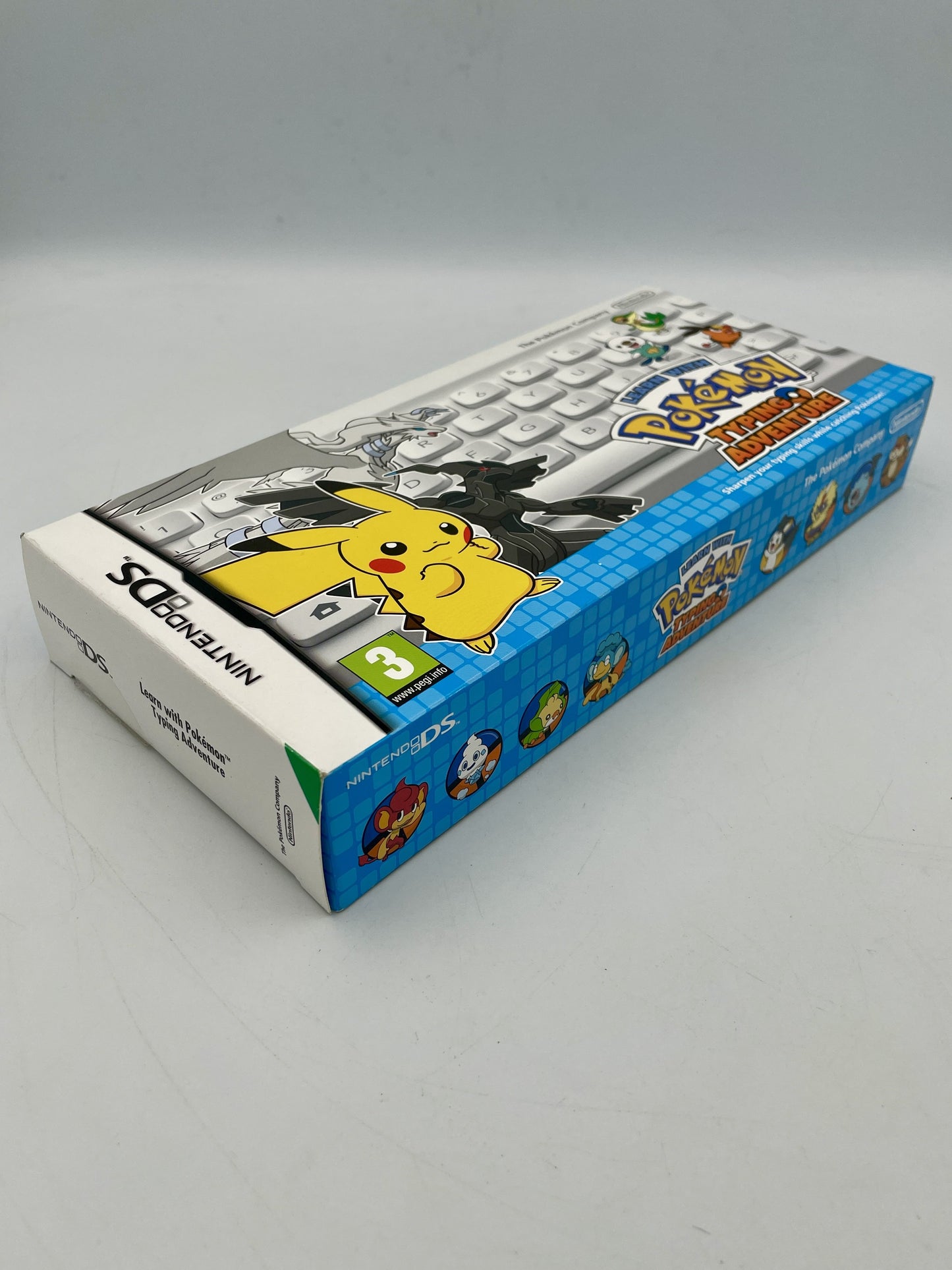 Pokémon game console packaging with Pikachu on a gray background
