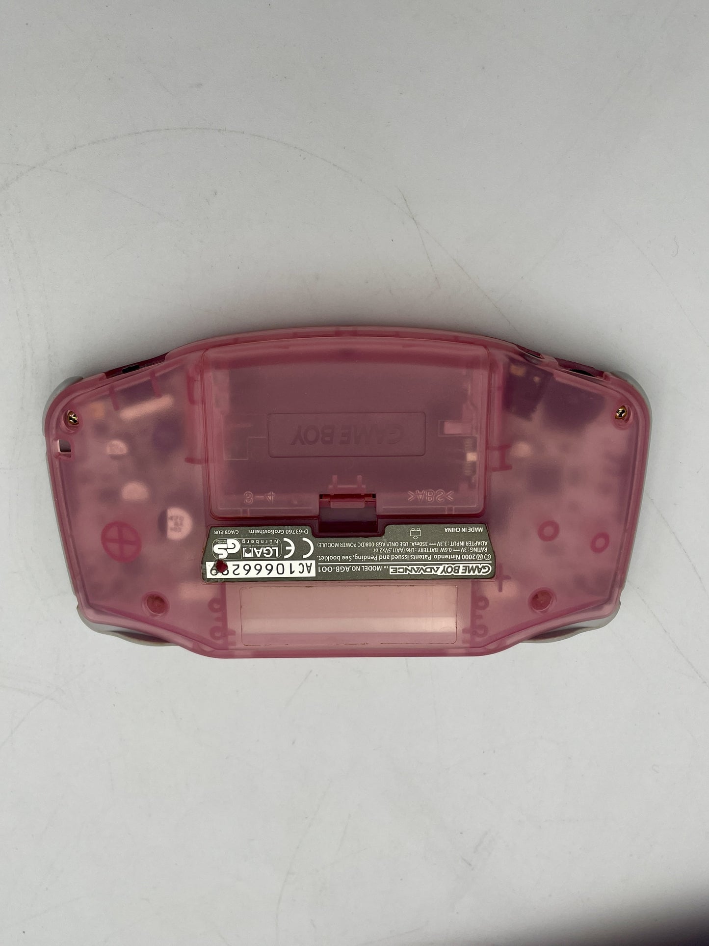 Pink Game Boy Advance shell on a white background