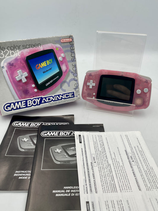 Pink Game Boy Advance console with packaging and manuals on a white background