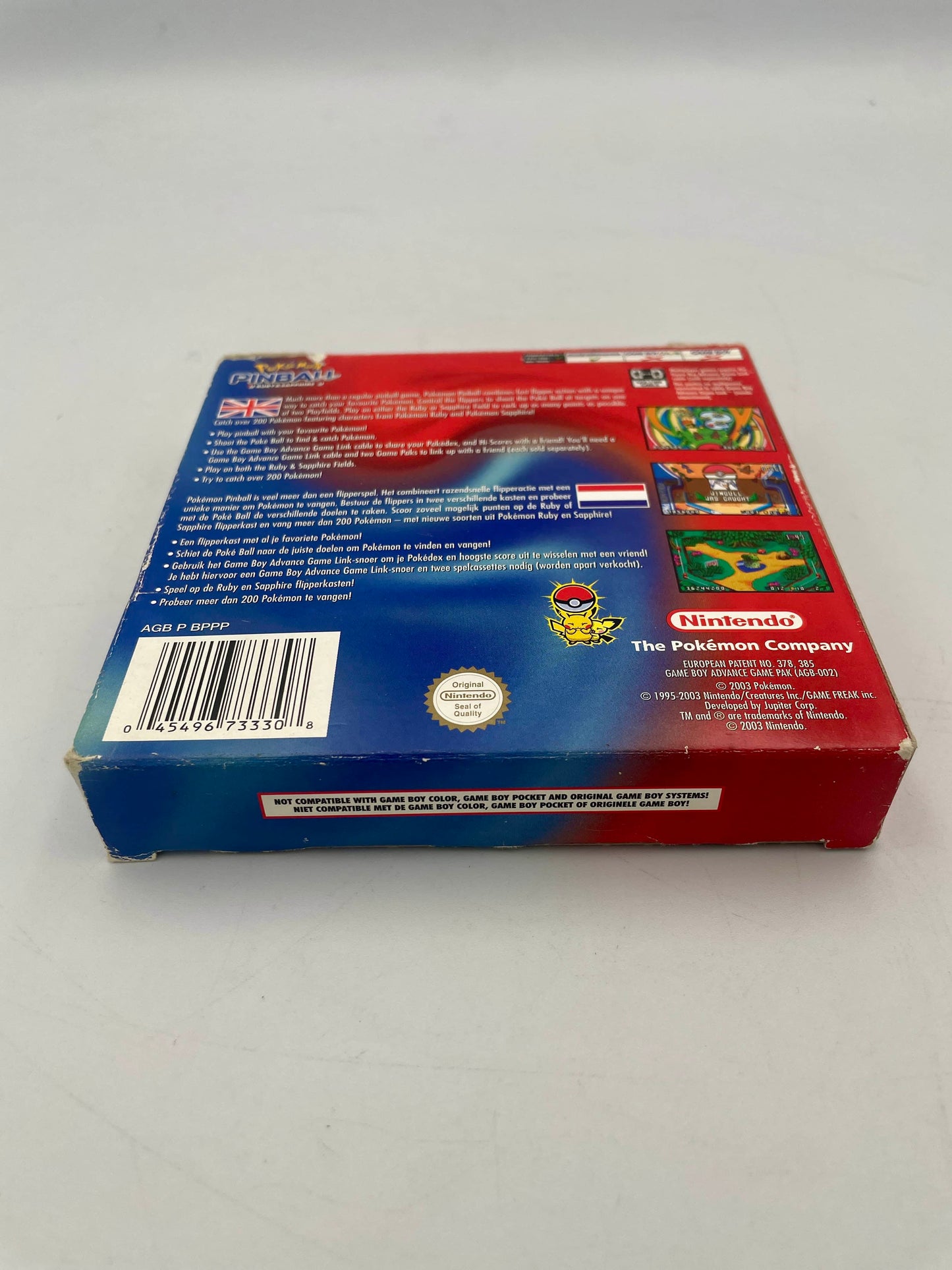 Back view of a red and blue box with Nintendo and Pokémon branding on a gray background