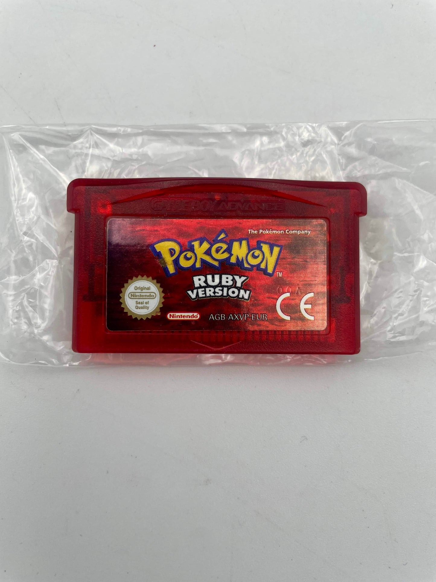Pokémon Ruby Version game cartridge in red packaging on a white background