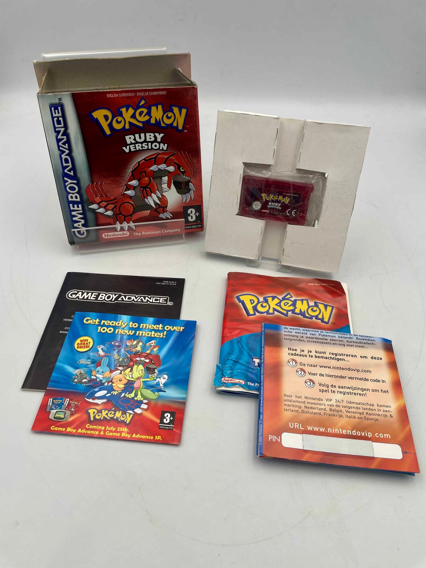 Pokémon Ruby Version Game Boy Advance game with accessories on a white background