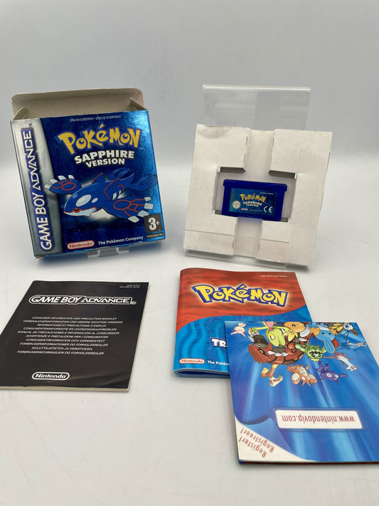 Pokémon Sapphire Version Game Boy Advance game case with manuals on a white background