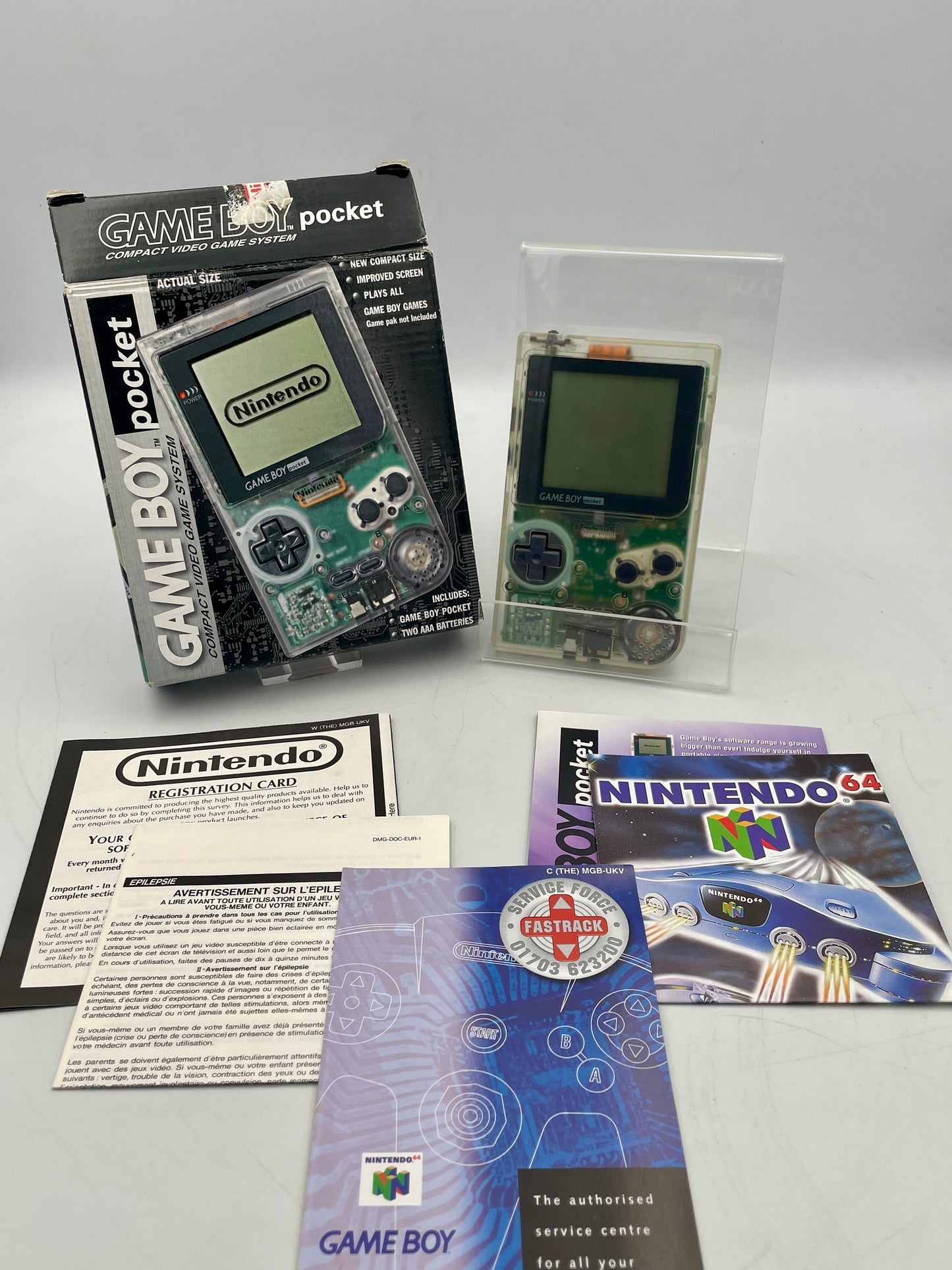 Nintendo Game Boy Pocket with packaging and accessories on a white background