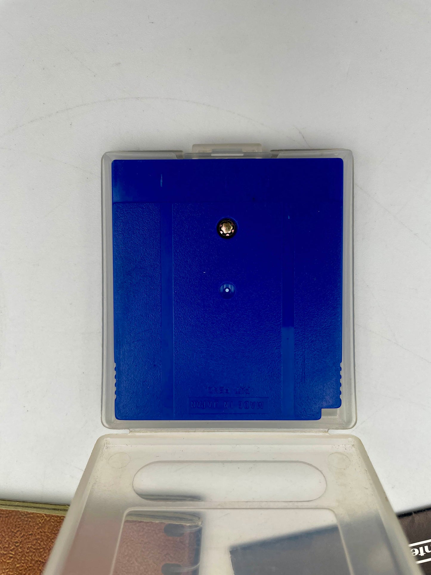 Clear plastic case with blue interior on a white background