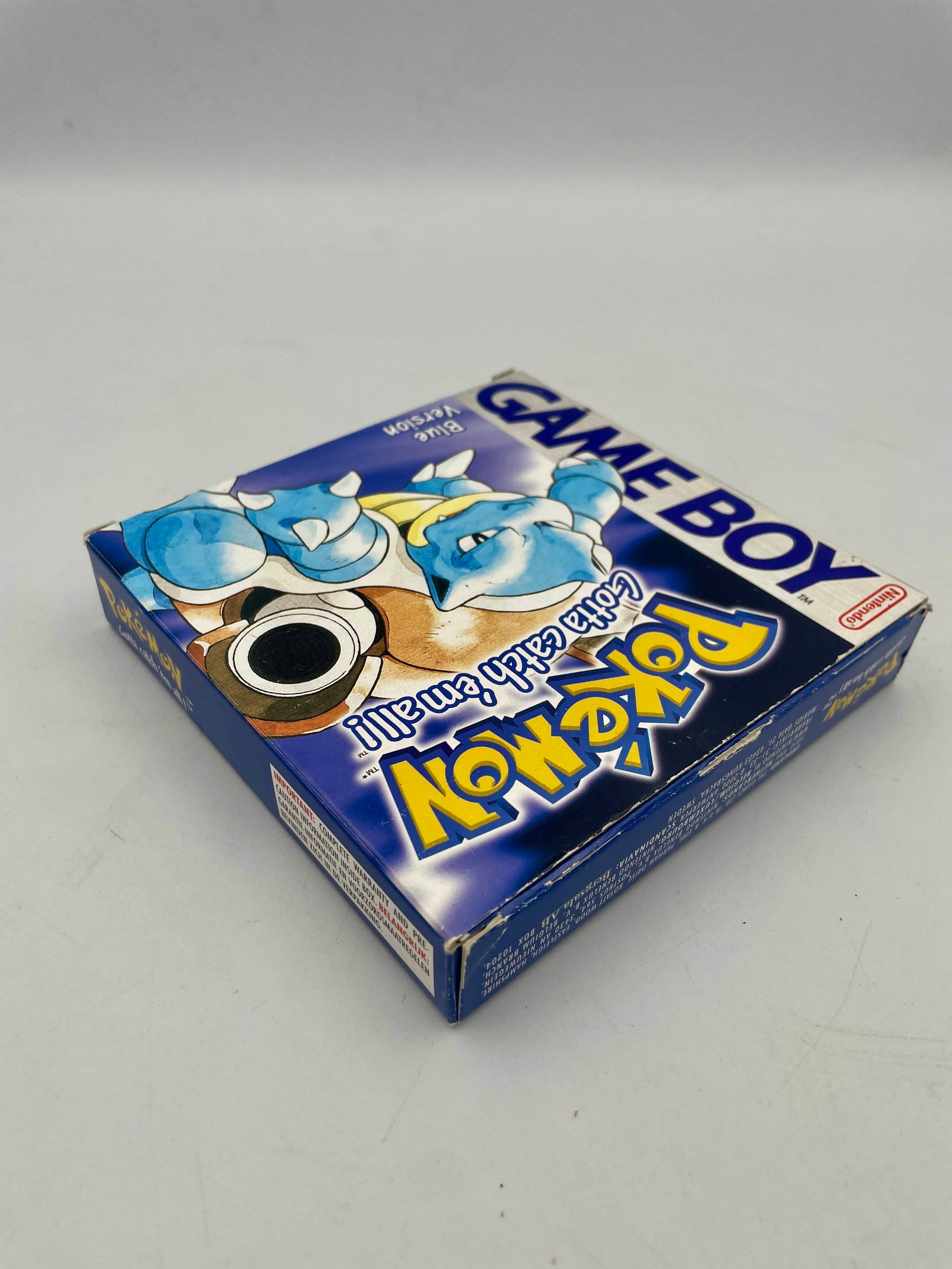 Blue Game Boy packaging with cartoon characters on a gray background
