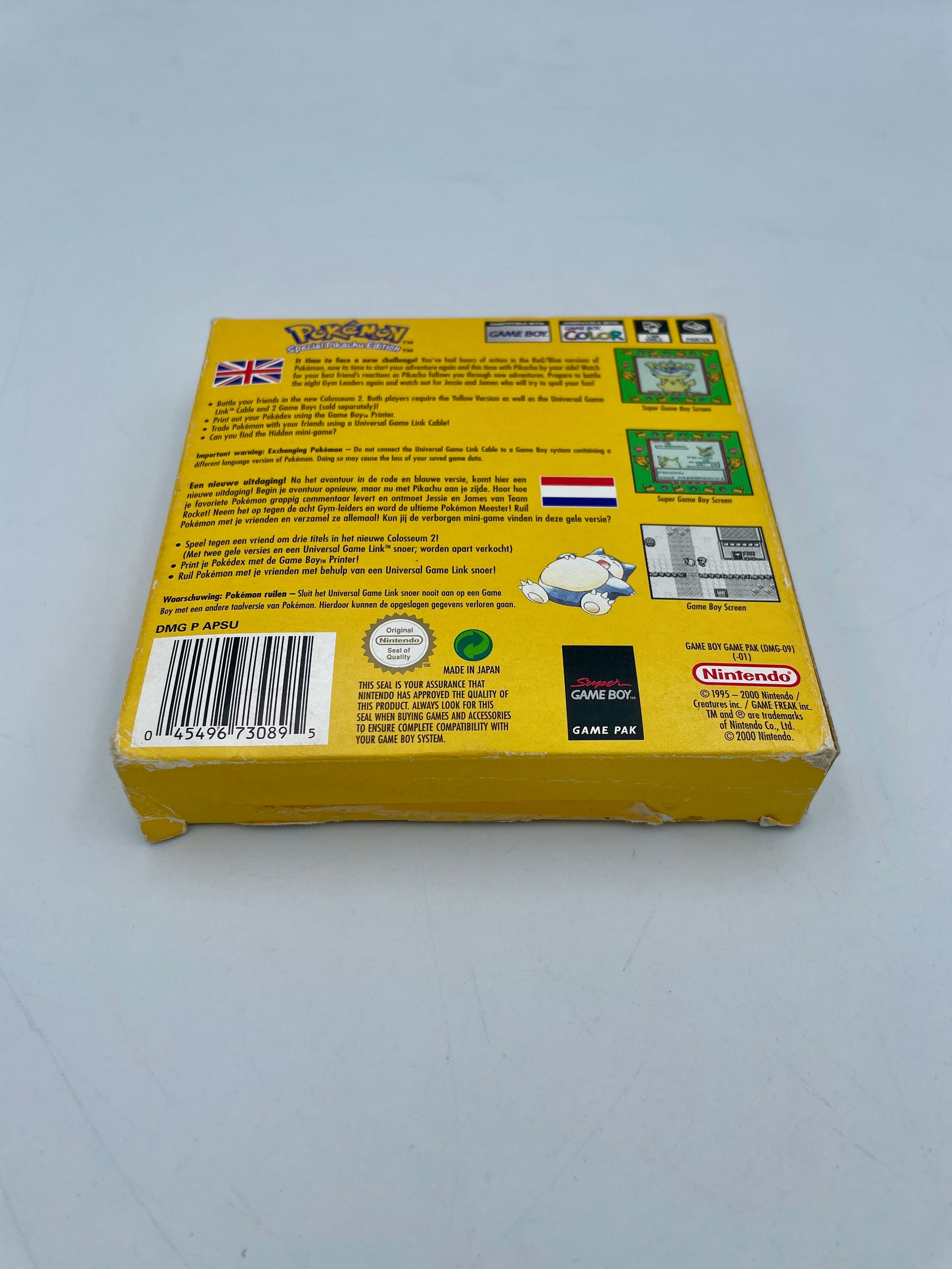 Back view of a yellow Game Boy Color game case with text and logos on a white background