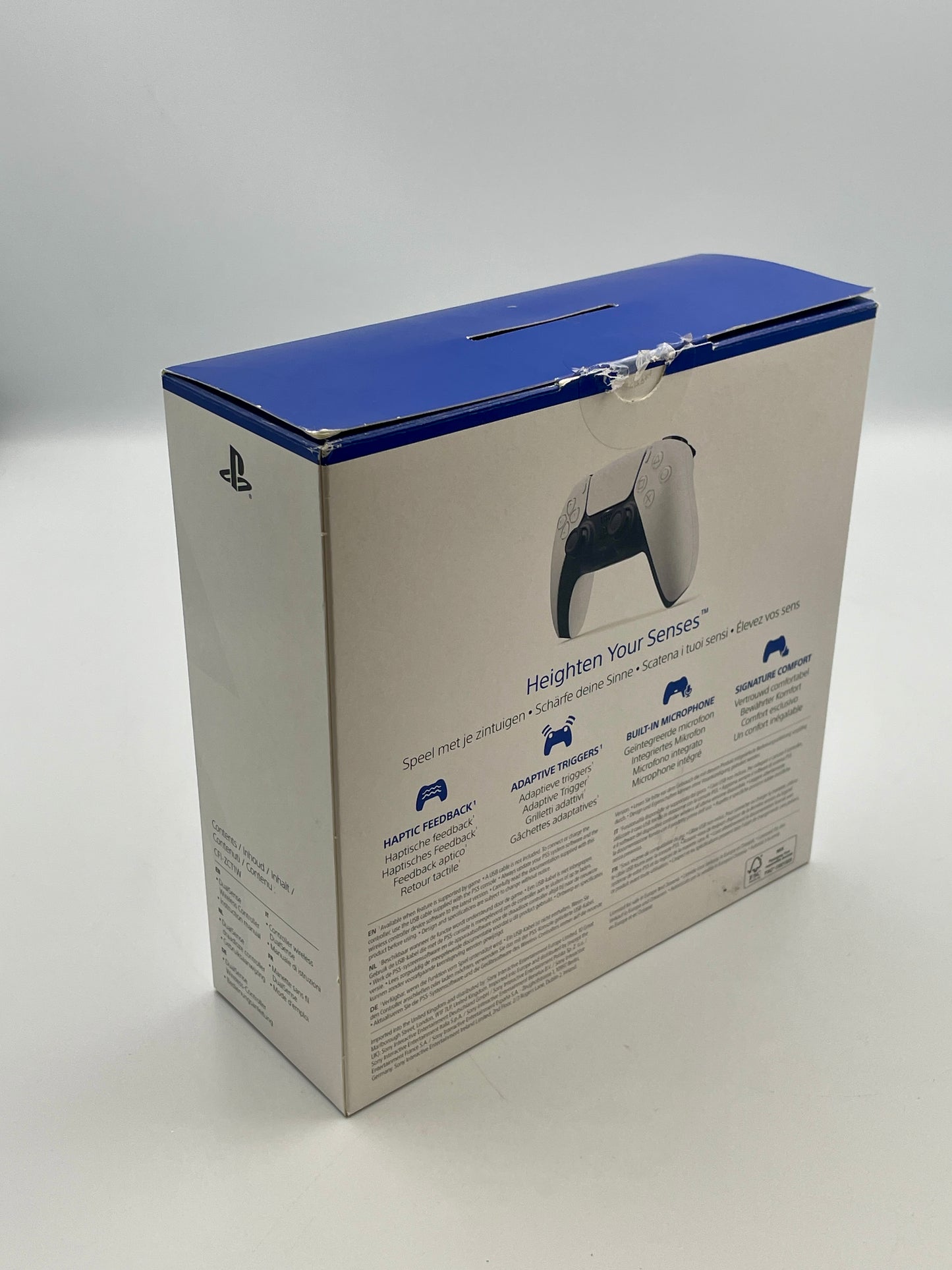 PlayStation controller packaging with blue lid on a white background