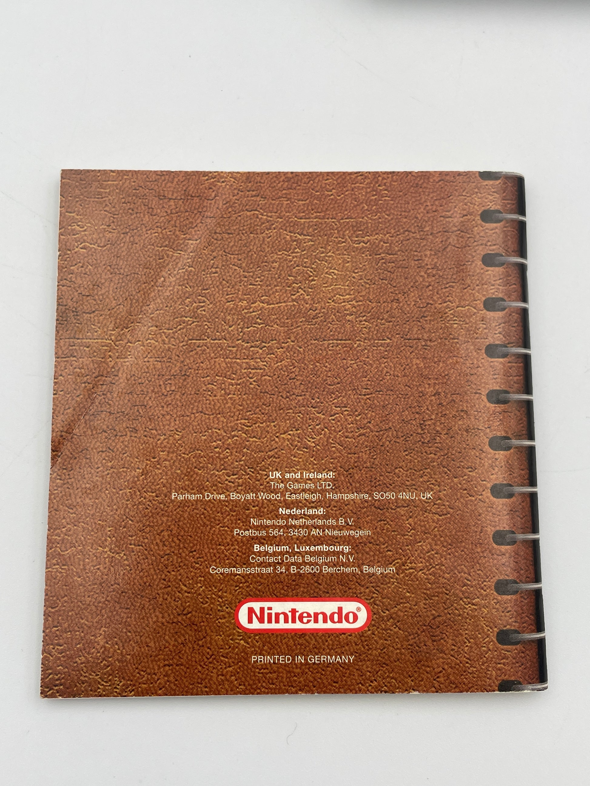 Brown notebook with Nintendo logo on a white background