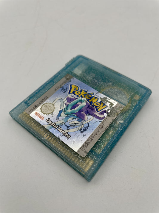 Vintage Pokémon Crystal Version game cartridge on a light gray background