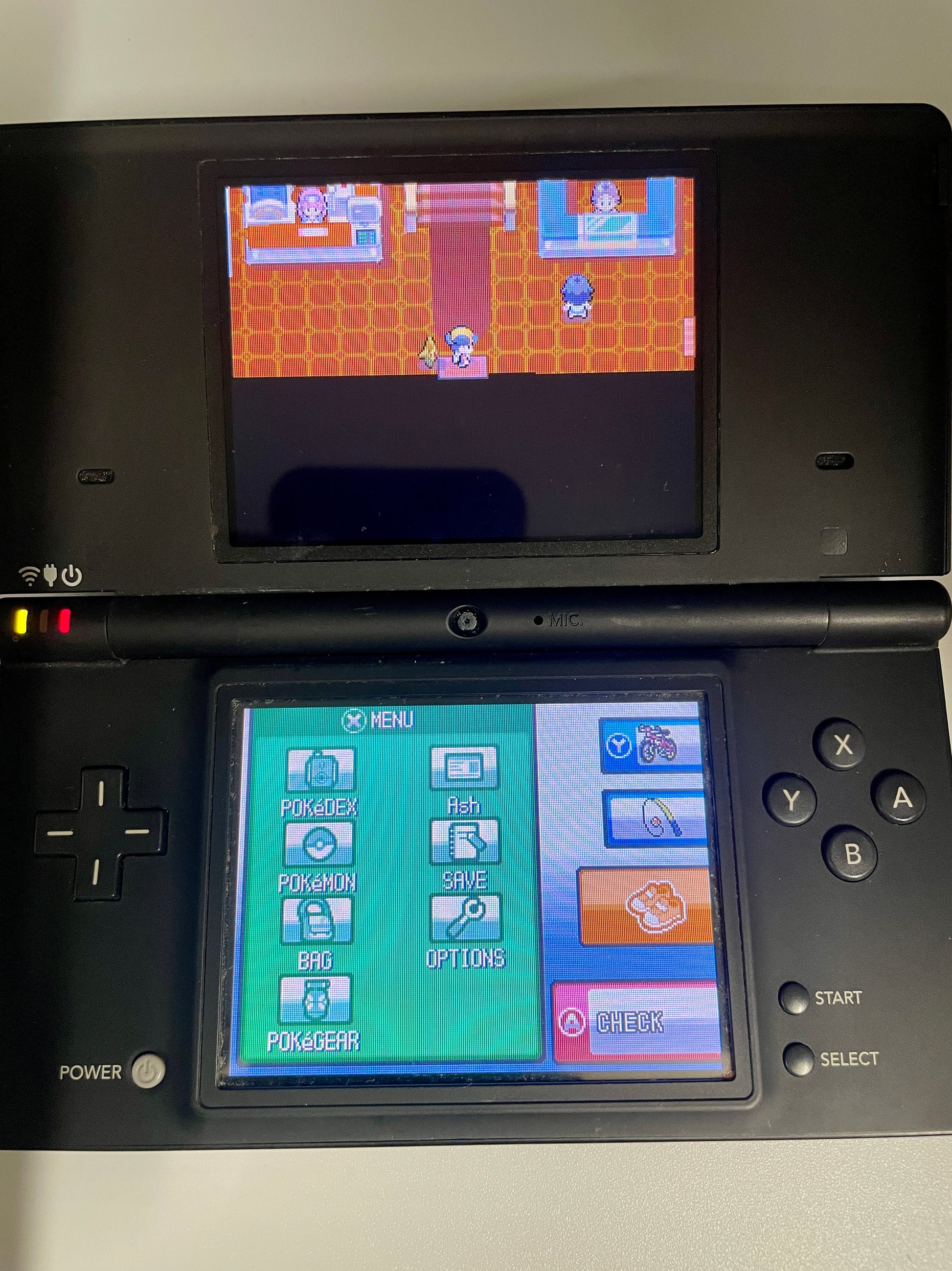 Nintendo DS gaming console with a game displayed on the screen