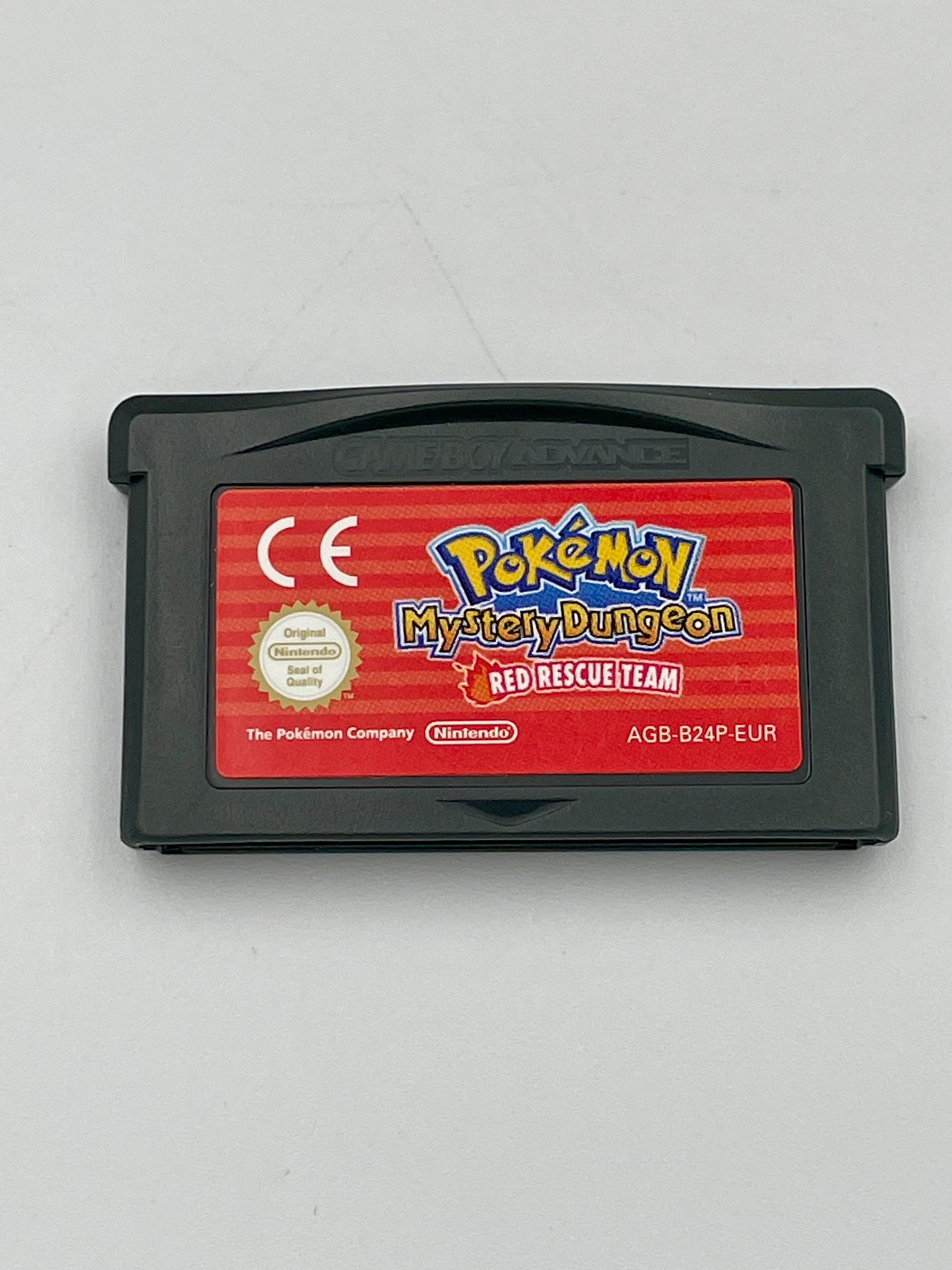 Pokémon Mystery Dungeon Red Rescue Team game cartridge on a gray background