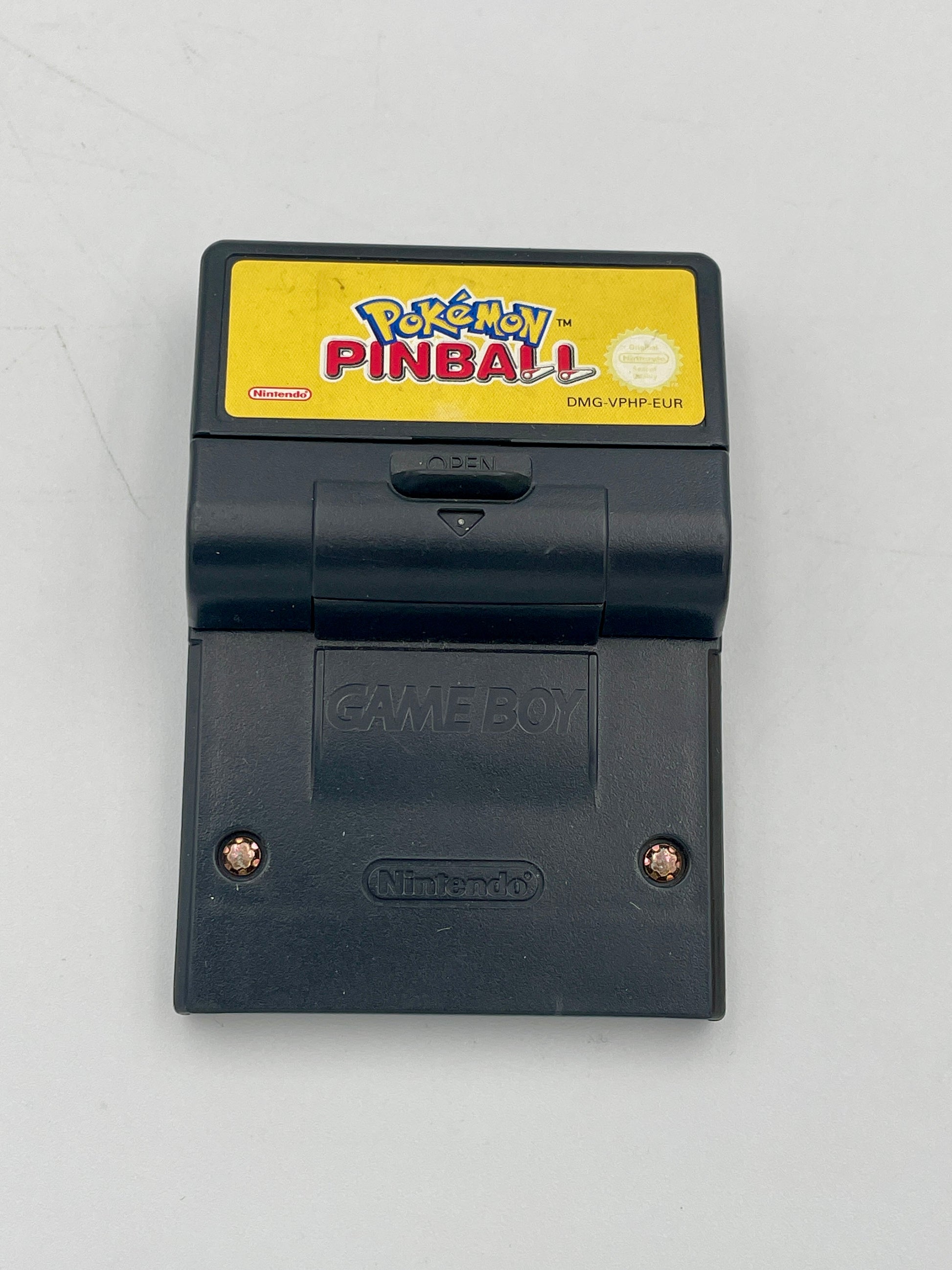 Nintendo Game Boy with a 'Pokémon Pinball' cartridge on a light gray background