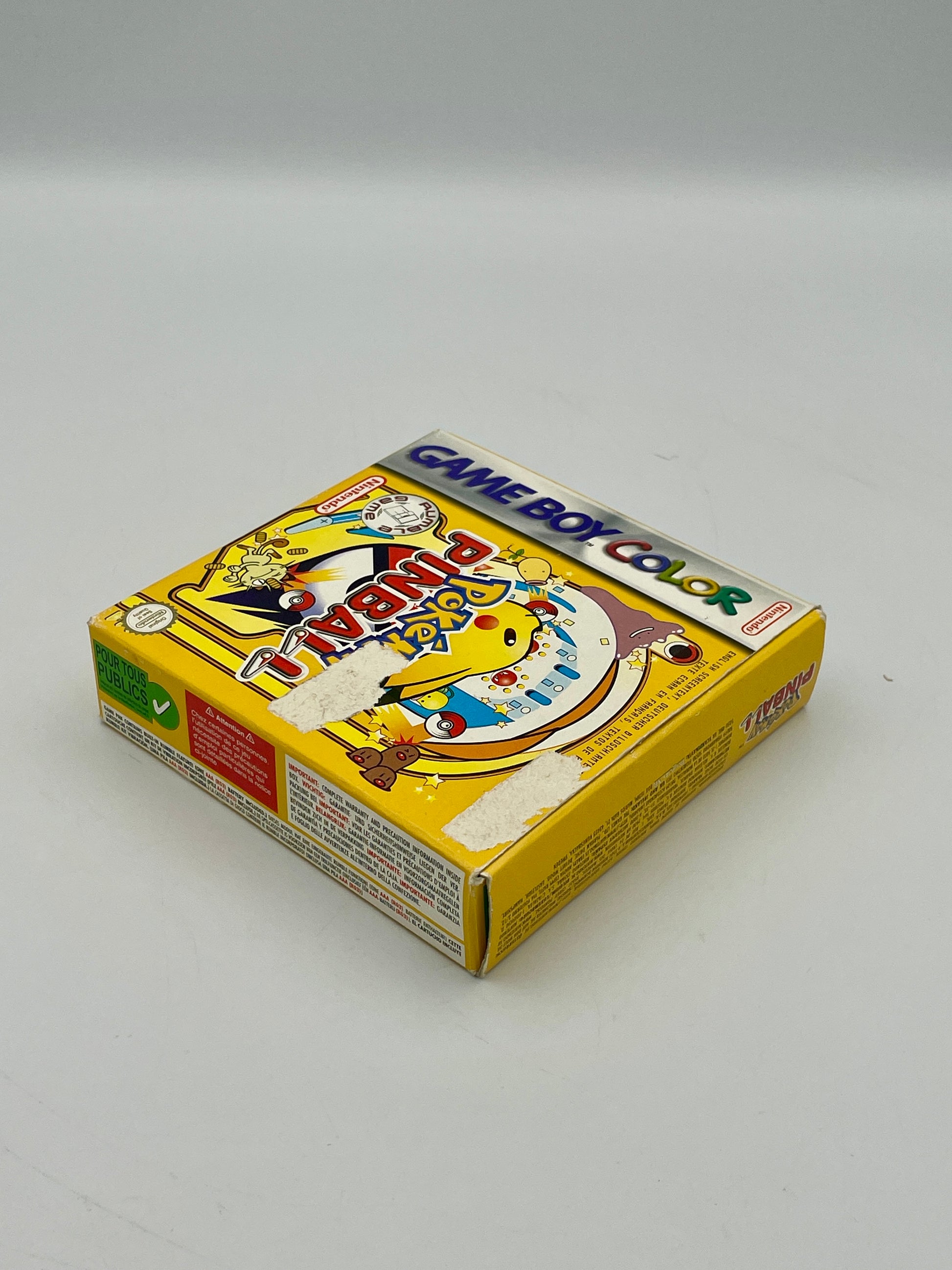 Yellow Game Boy Color packaging with branding on a gray background