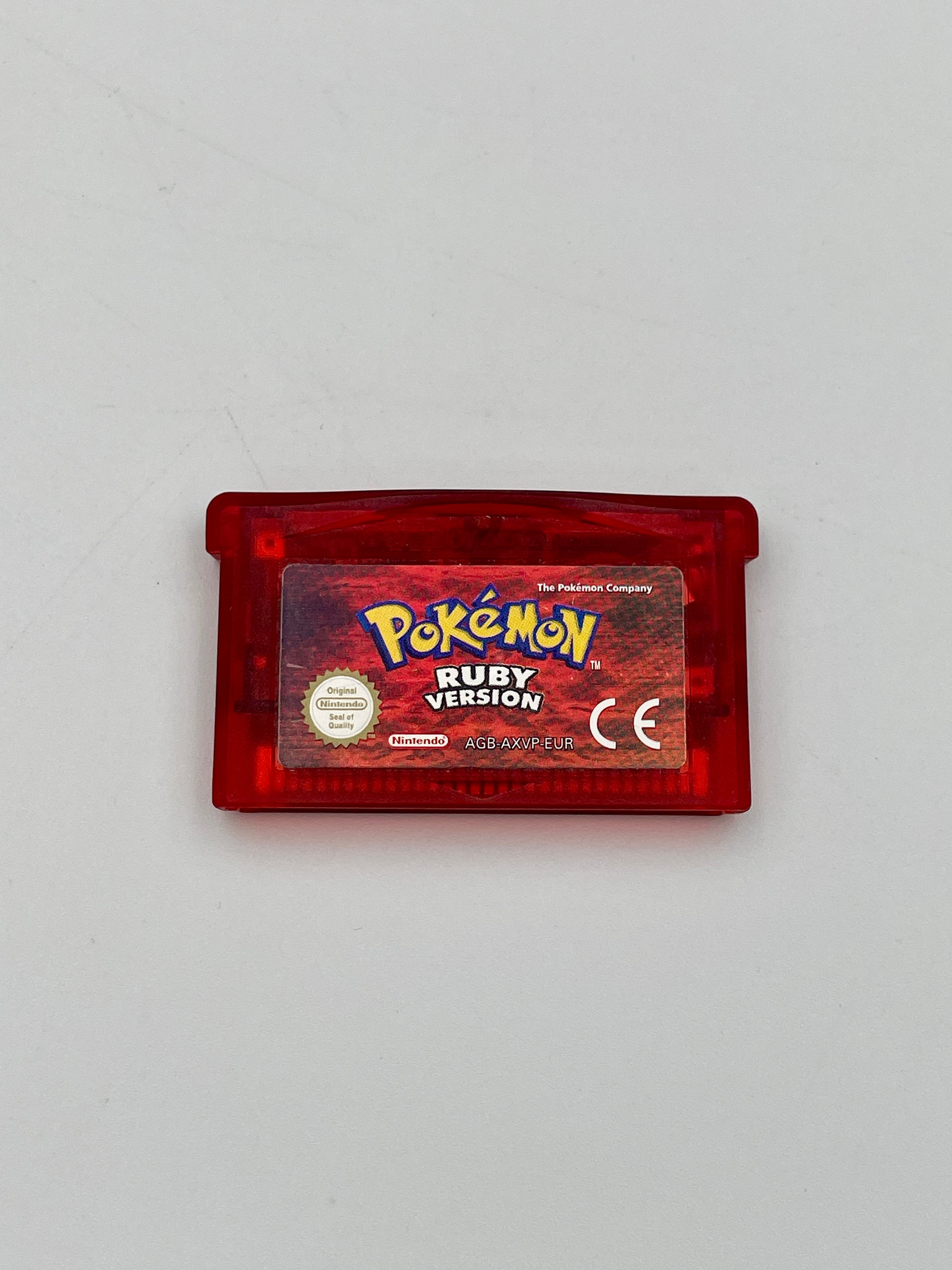 Red Game Boy cartridge with 'Pokémon Ruby Version' on a gray background