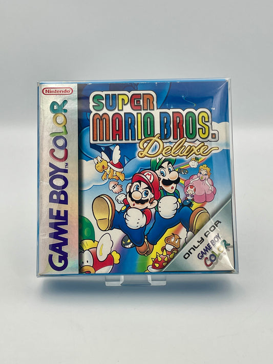 Super Mario Bros. Deluxe Game Boy Color packaging on a gray background