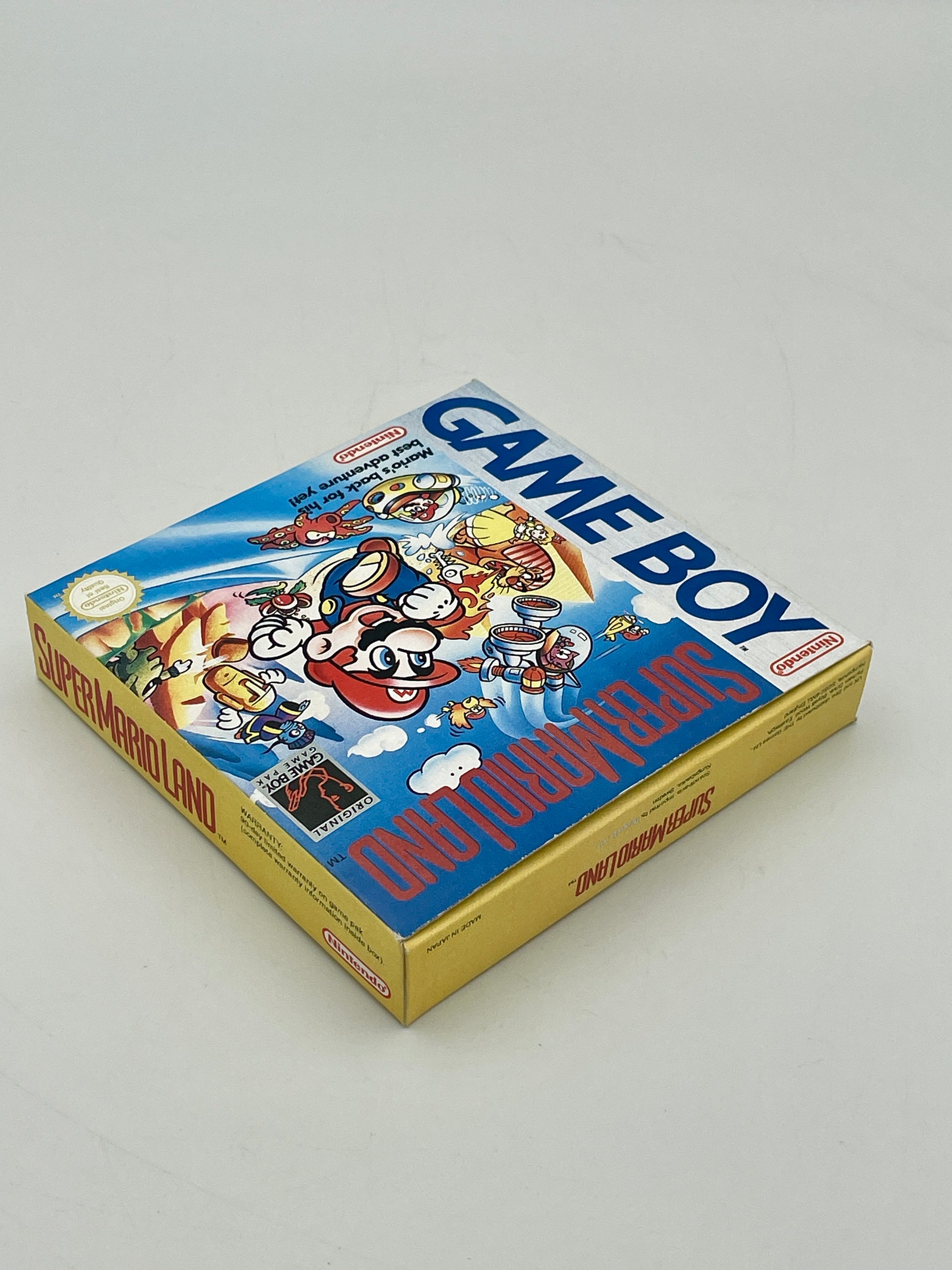 Super Mario Bros Game Boy packaging on a gray background