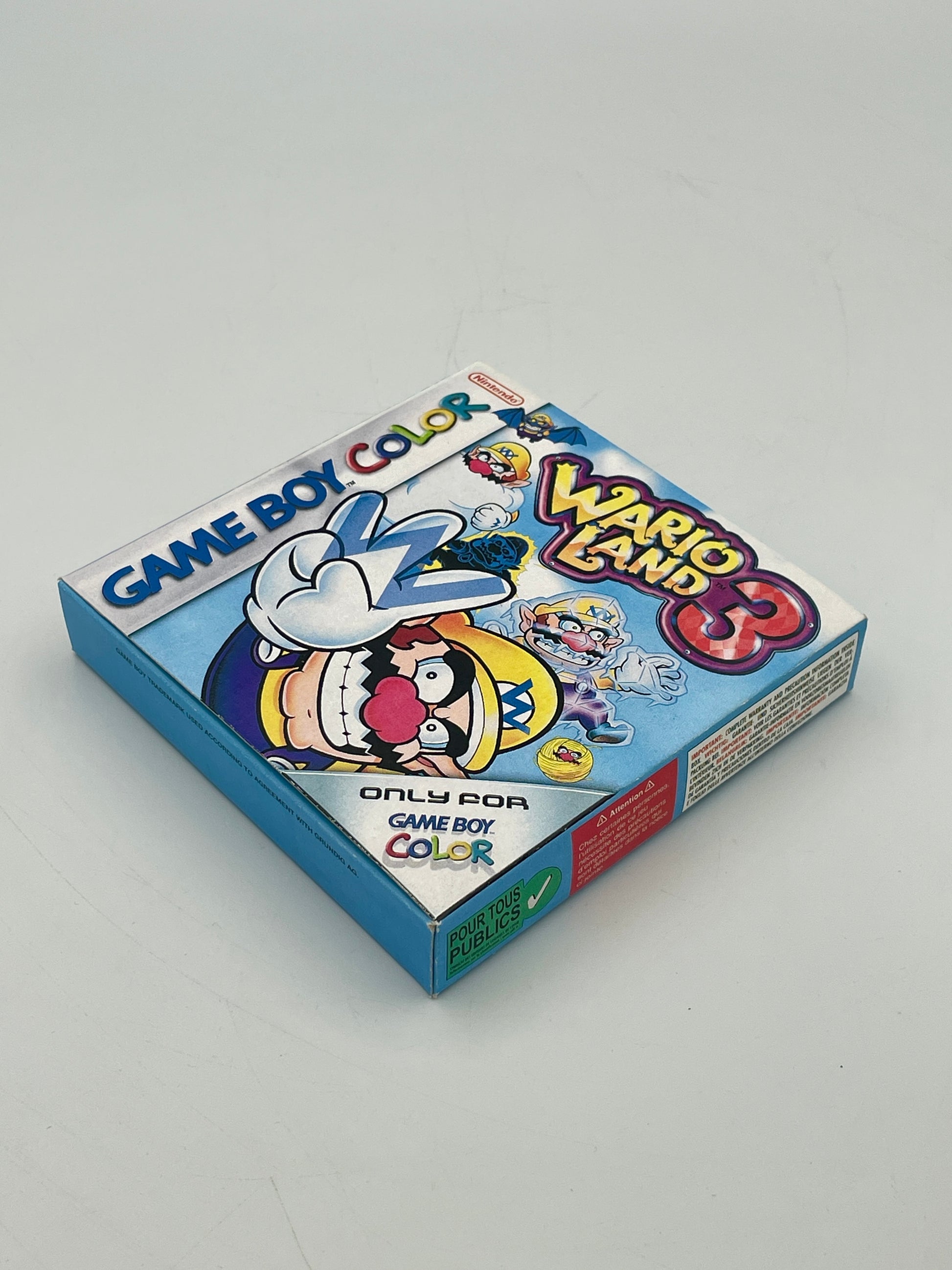 Game Boy Color game case for 'Wario Land 3' on a gray background