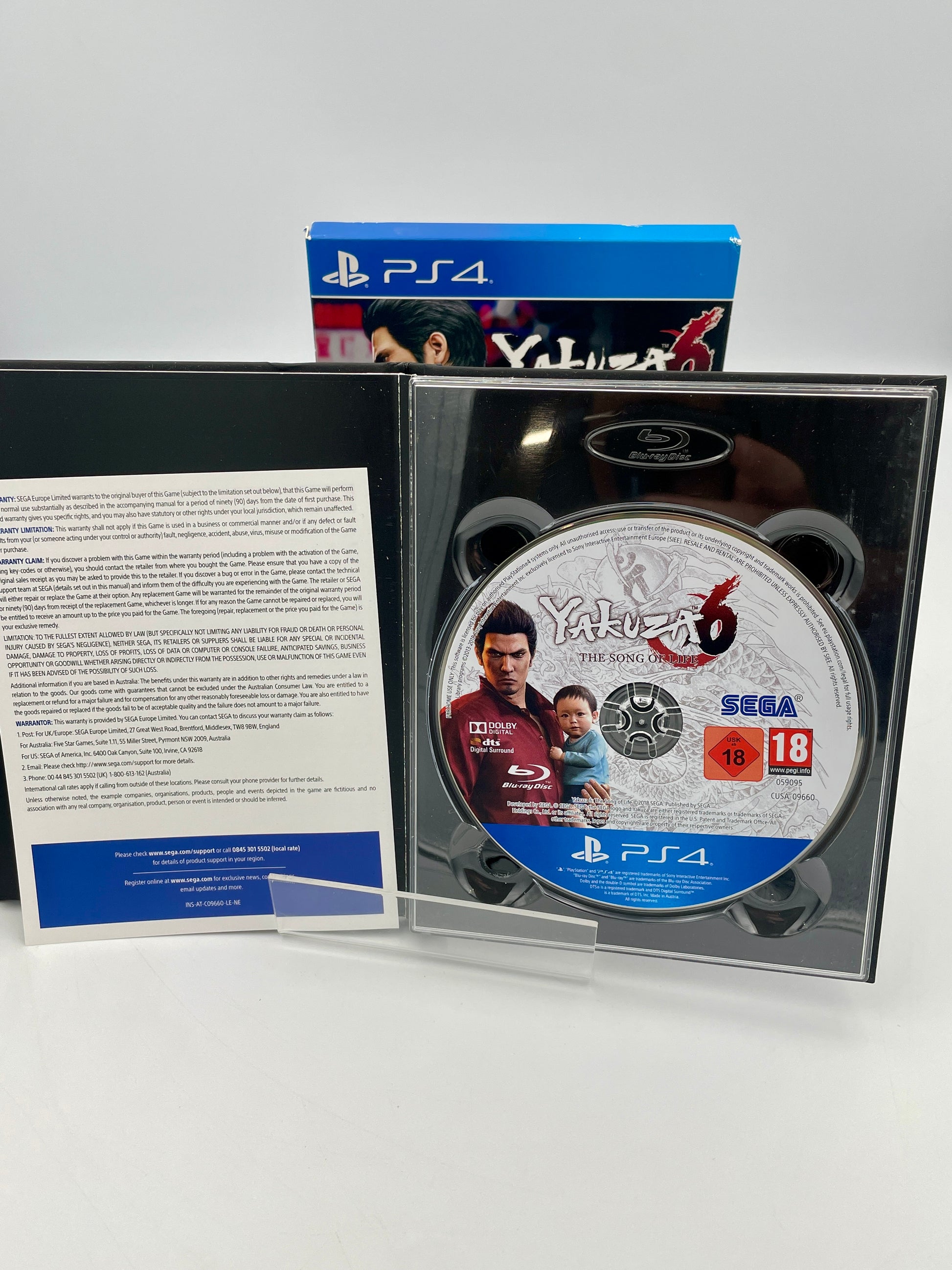 Yakuza 6 PlayStation 4 game disc and case on a white background