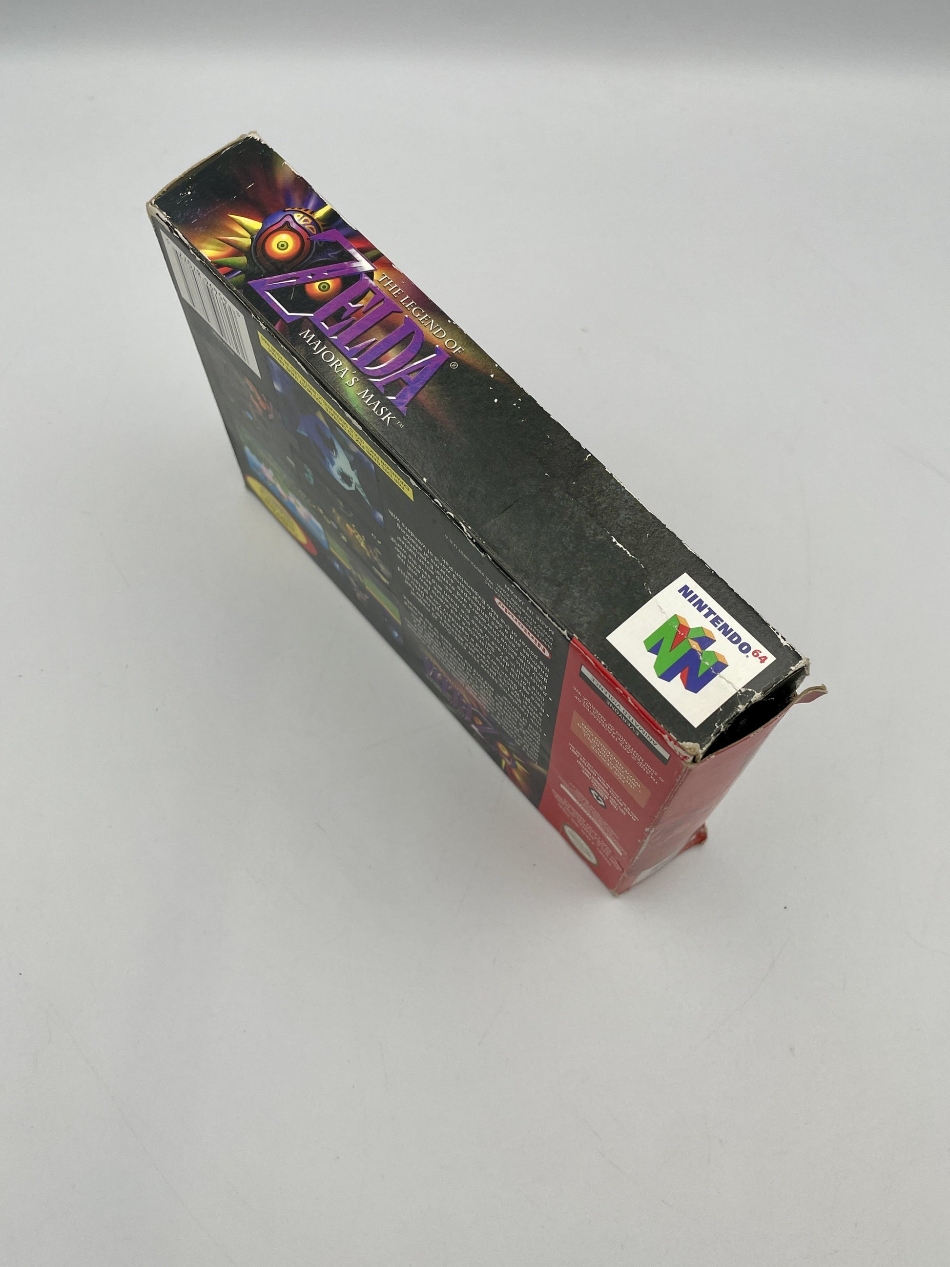 Vintage 'The Legend of Zelda' game box for Nintendo 64 on a gray background