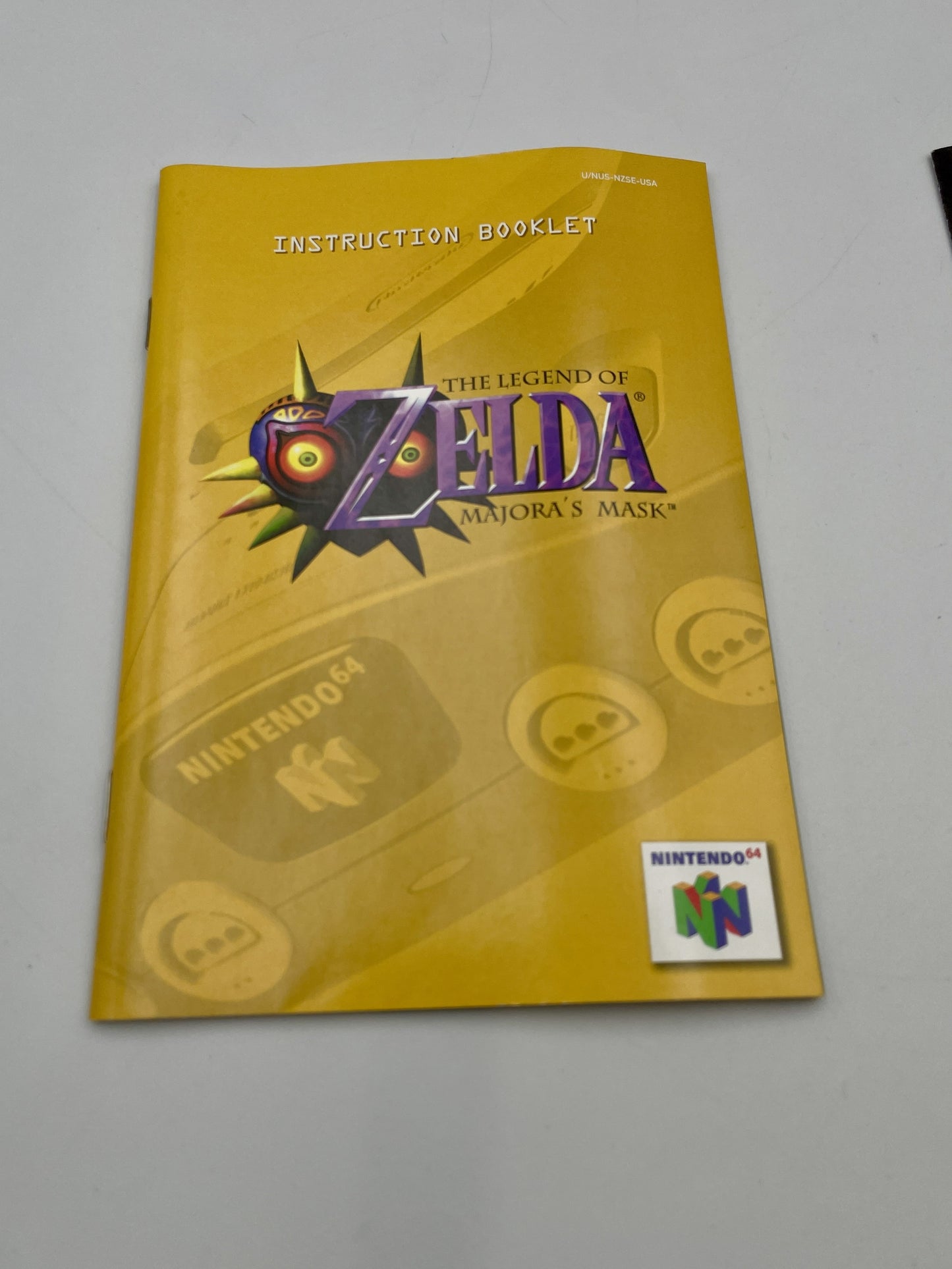 Instruction booklet for 'The Legend of Zelda: Majora's Mask' on a gray background