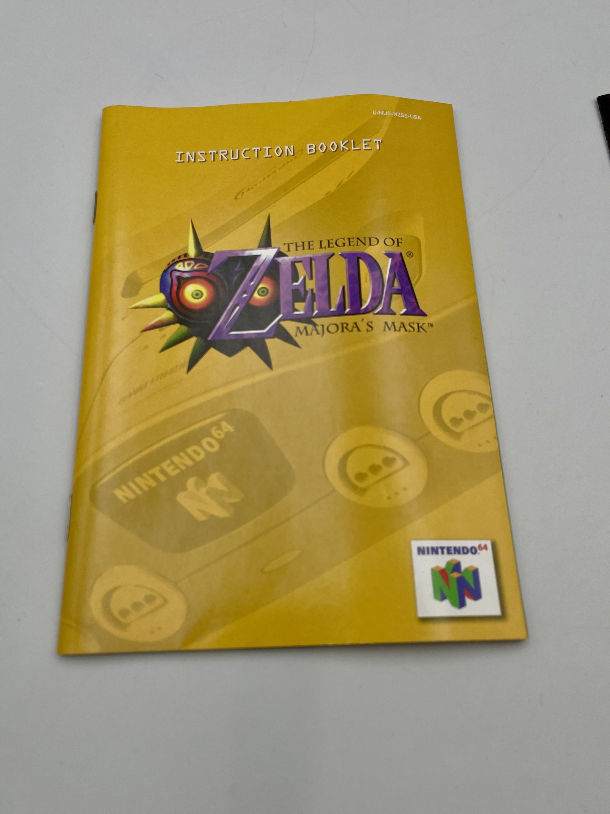 Instruction booklet for 'The Legend of Zelda: Majora's Mask' on a gray background