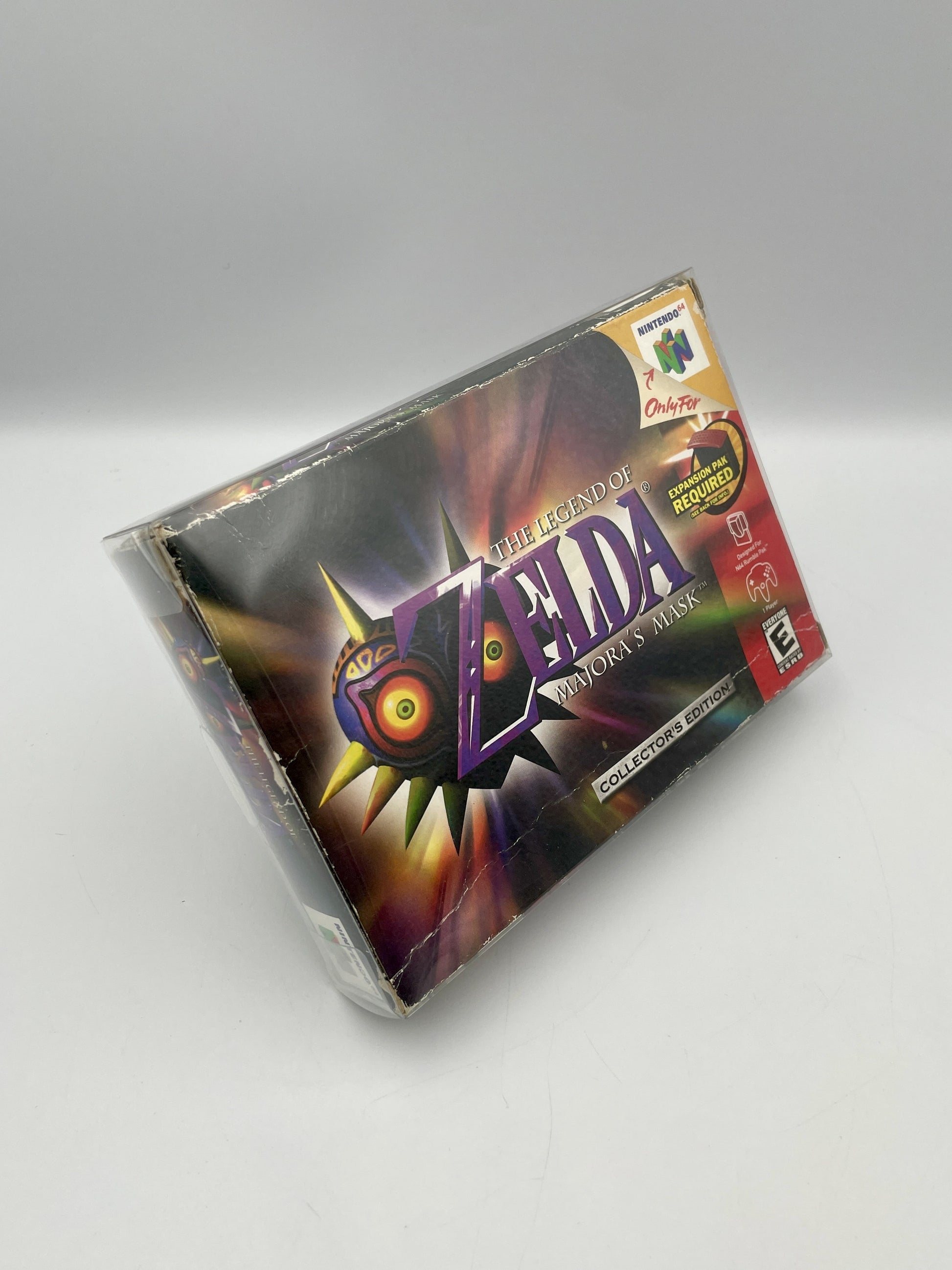 Vintage 'The Legend of Zelda: Majora's Mask' game box on a gray background